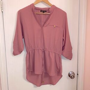 New Glory pink top with cinched brown waist and tie with gold accents v neck